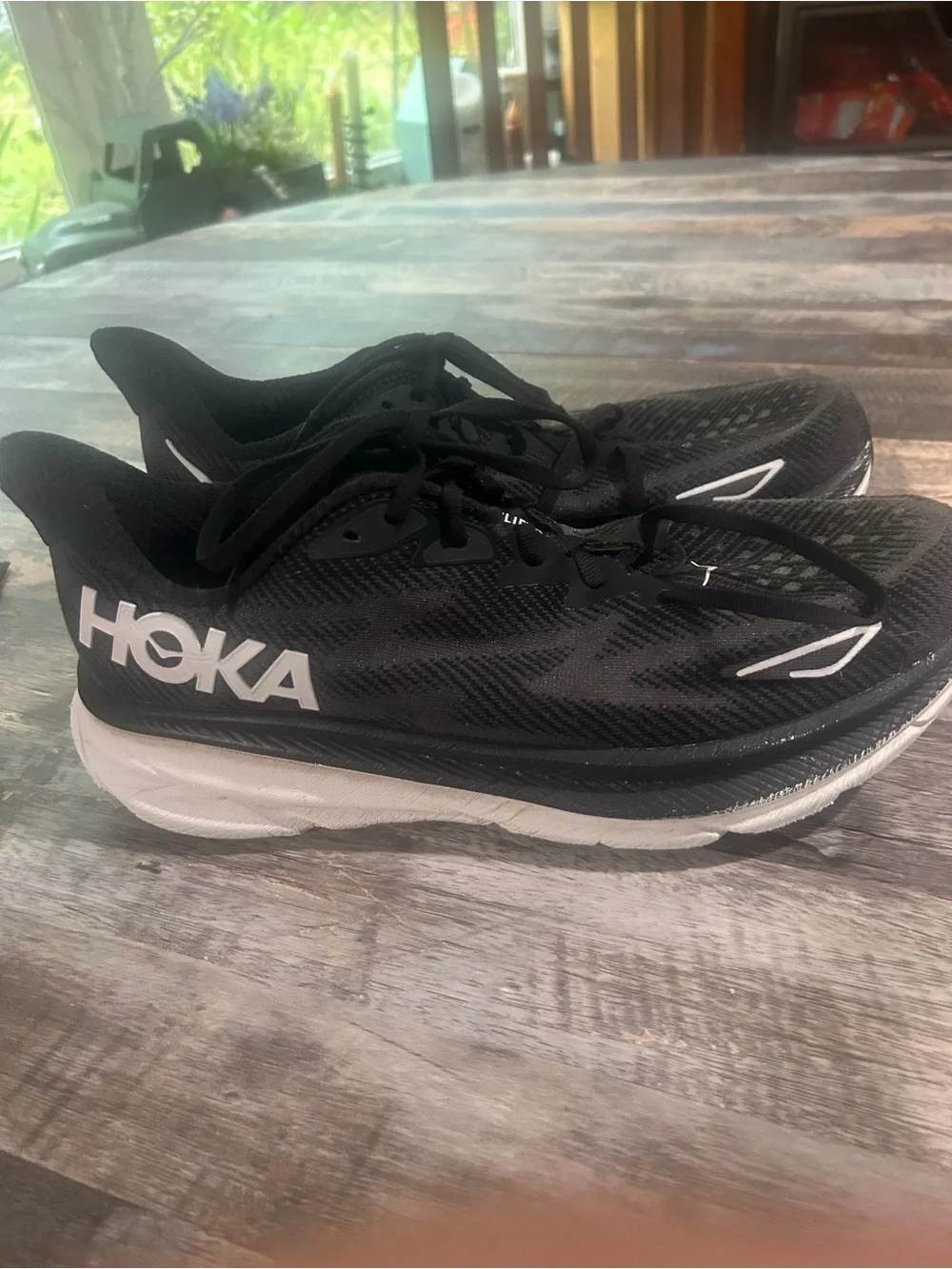 Men's size 11.5D Hoka Black and White Road Running Shoes